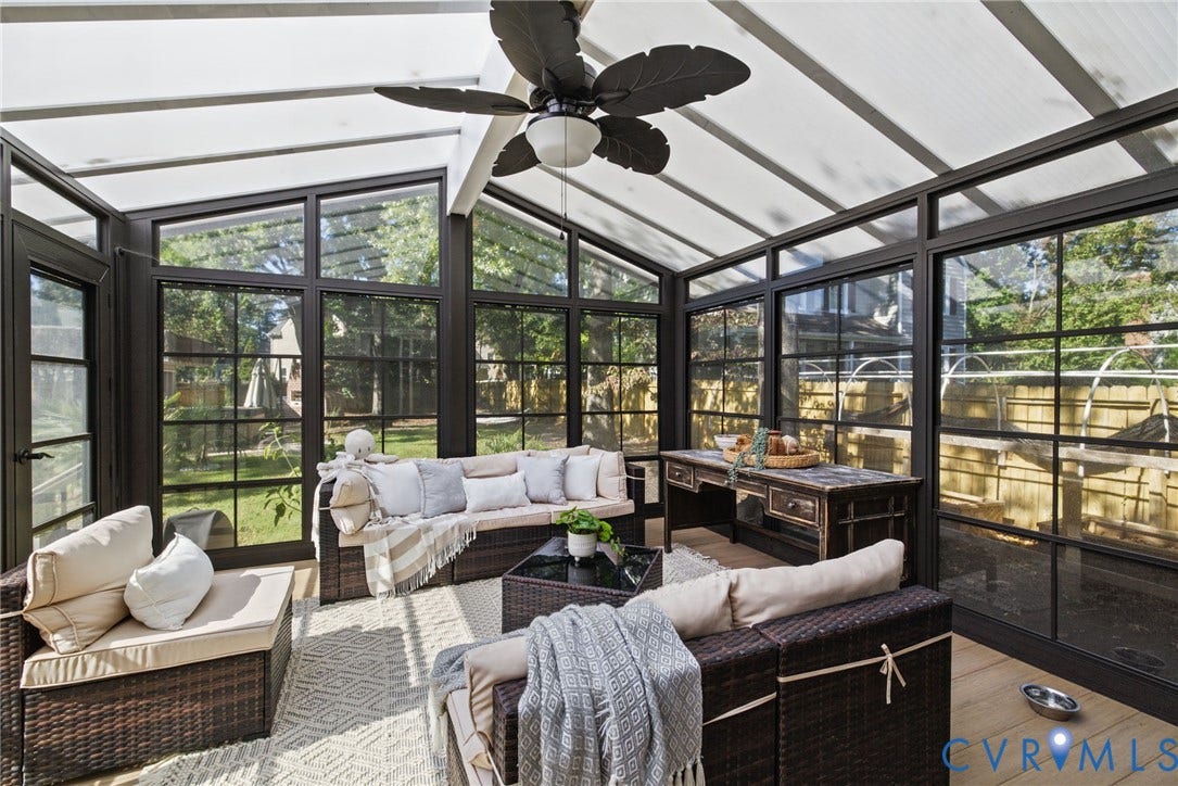 4504 Argonne Court, Glen Allen, VA 23060 Sunroom featuring a translucent gabled roof, dark-framed multi-pane windows, wood-finish flooring, and a ceiling fan with integrated lighting
