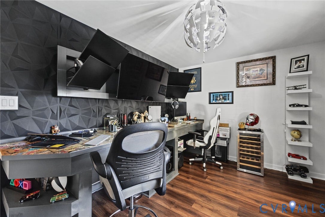 4504 Argonne Court, Glen Allen, VA 23060 Textured geometric accent wall, built-in desk with metallic finish, wood-finish flooring, floating wall shelves, and multi-faceted modern ceiling fixture