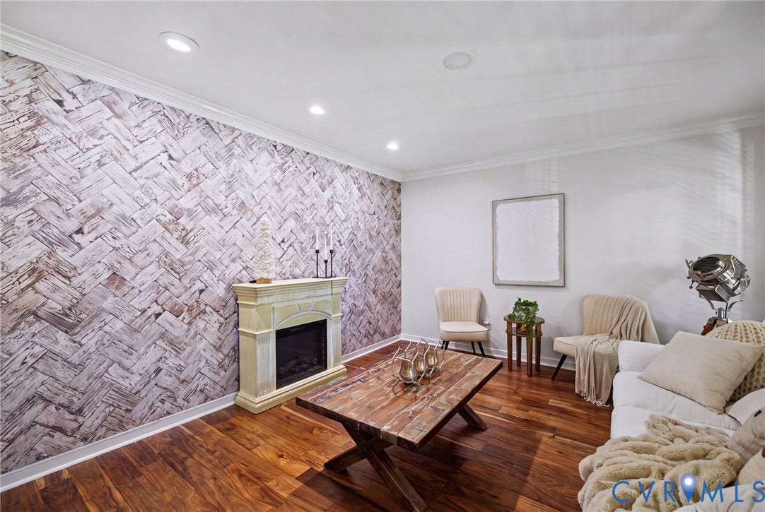 4504 Argonne Court, Glen Allen, VA 23060 Herringbone-patterned accent wall, wood-finish flooring, built-in fireplace with a decorative mantel, and recessed lighting