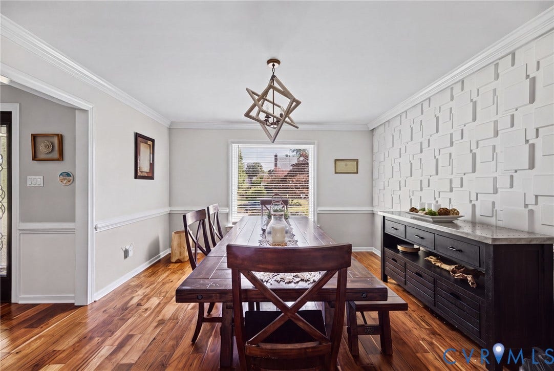 4504 Argonne Court, Glen Allen, VA 23060 Textured geometric accent wall, wood-finish flooring, crown molding, chair rail trim, and custom geometric pendant light fixture