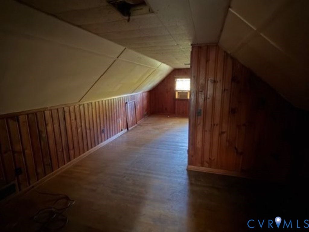 1330 Devers Road, Henrico, VA 23226 Finished attic space featuring wood-panelled walls, slanted ceilings, and wood-finish flooring