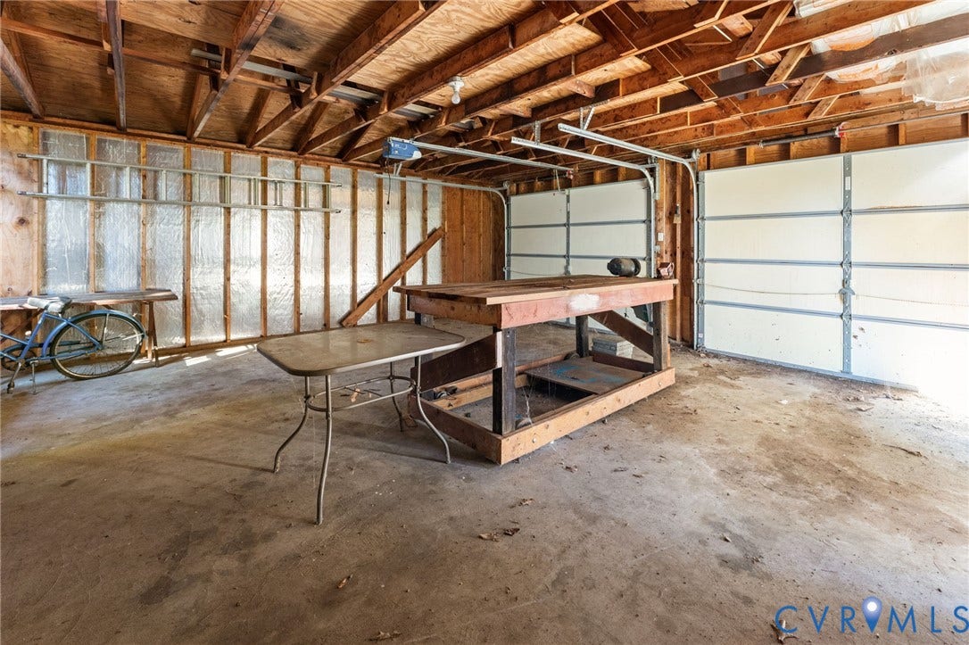 87 Pier Place, Town Of Kinsale, Kinsale, VA 22488 Two-car garage with concrete flooring and workbench.