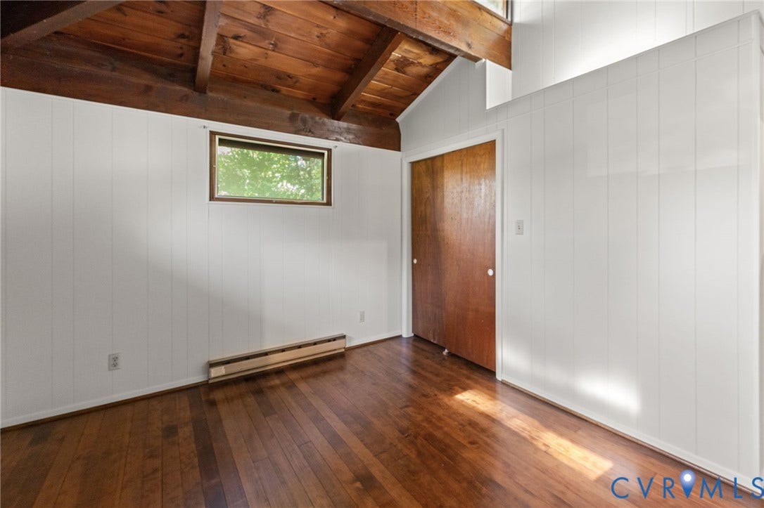 87 Pier Place, Town Of Kinsale, Kinsale, VA 22488 Primary Bedroom with vaulted, exposed cedar-beamed ceiling, wood floors & half Bath.