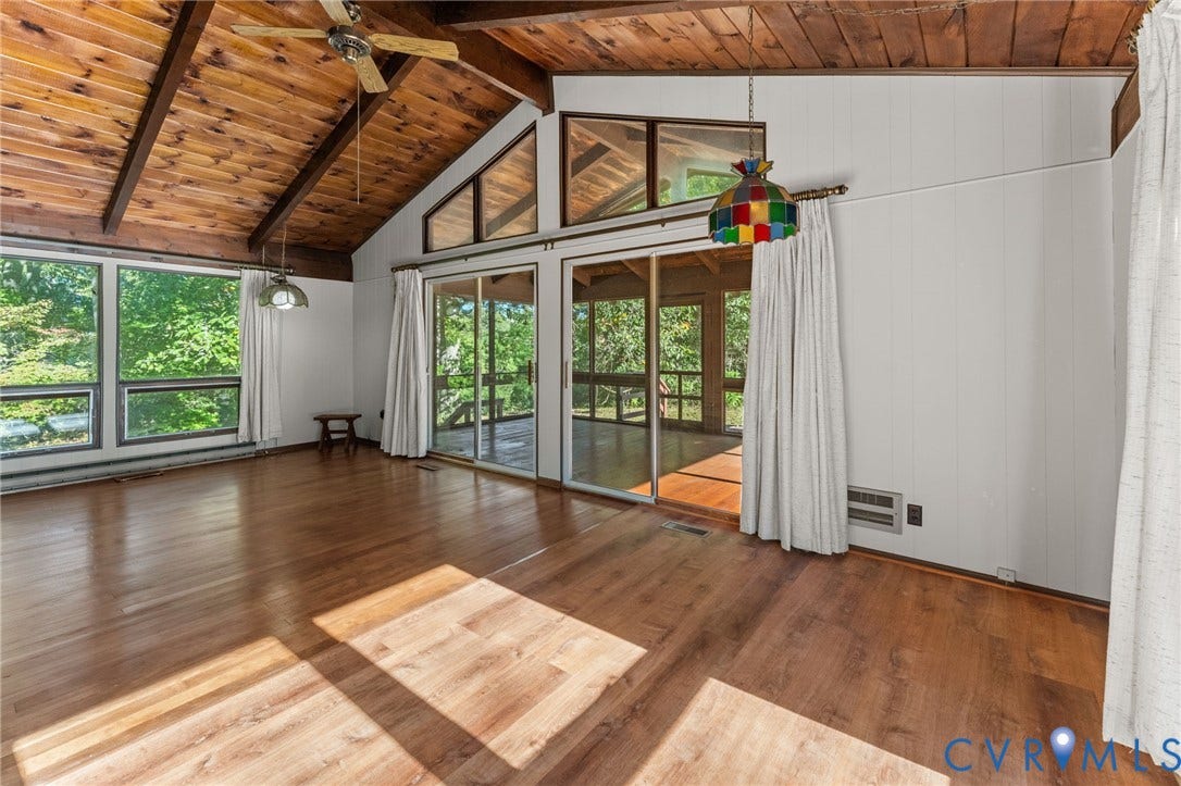 87 Pier Place, Town Of Kinsale, Kinsale, VA 22488 Light & bright Great Room with vaulted, exposed cedar-beamed ceiling, wood floors, ceiling and & dining area. View of Kinsale Creek from Great Room.