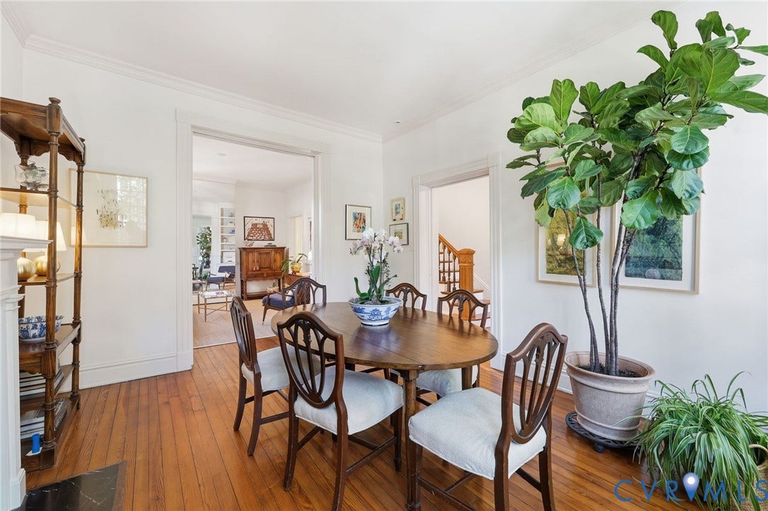 107 N Harvie Street, The Fan, Richmond, VA 23220 Dining area featuring hardwood flooring, crown molding, and an arched doorframe