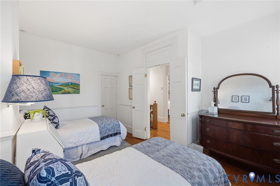 107 N Harvie Street, The Fan, Richmond, VA 23220 High ceilings with crown molding, wood-finish flooring, double-panel interior doors, and custom chair rail wainscoting