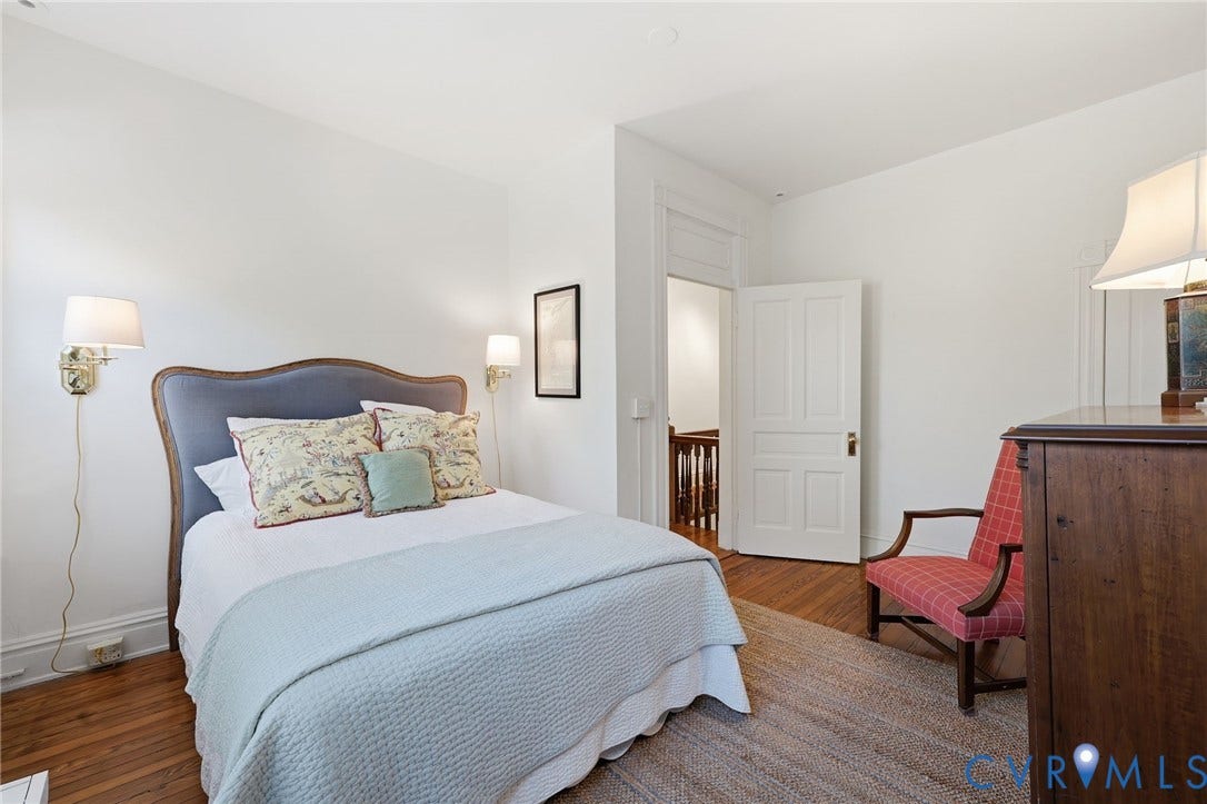 107 N Harvie Street, The Fan, Richmond, VA 23220 Hardwood flooring, two wall-mounted adjustable sconces, and a multi-panel interior door