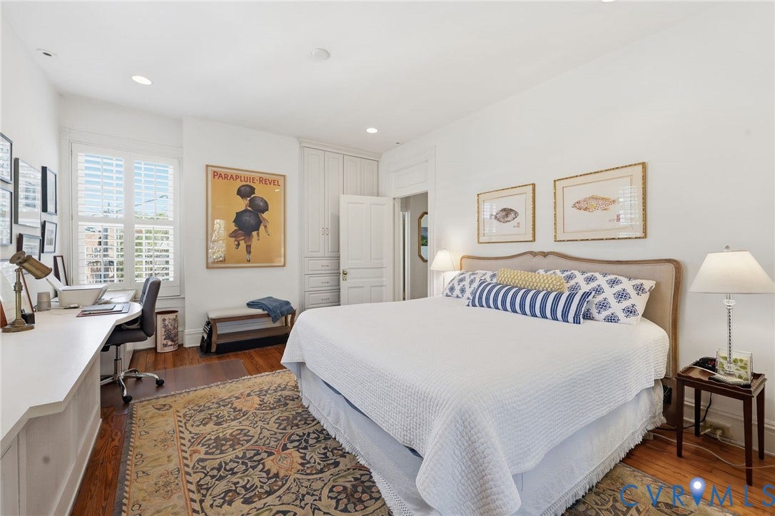 107 N Harvie Street, The Fan, Richmond, VA 23220 Built-in floor-to-ceiling cabinetry, custom desk surface, wood-finish flooring, recessed lighting, and white plantation shutters