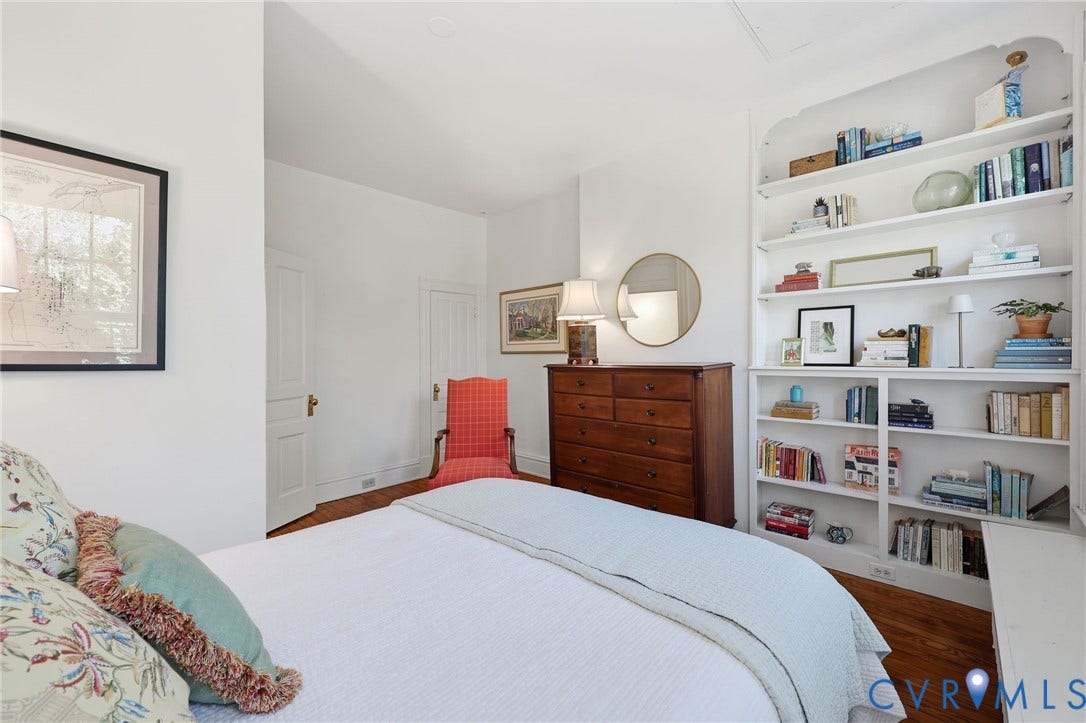 107 N Harvie Street, The Fan, Richmond, VA 23220 Built-in white floor-to-ceiling shelving and wood-finish flooring