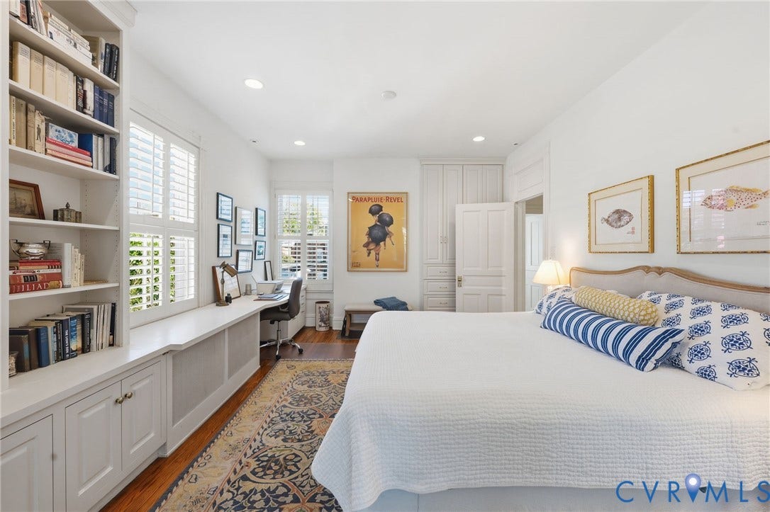 107 N Harvie Street, The Fan, Richmond, VA 23220 Custom built-in cabinetry featuring floor-to-ceiling bookshelves, integrated desk space, recessed ceiling lighting, plantation shutters, and wood-finish flooring