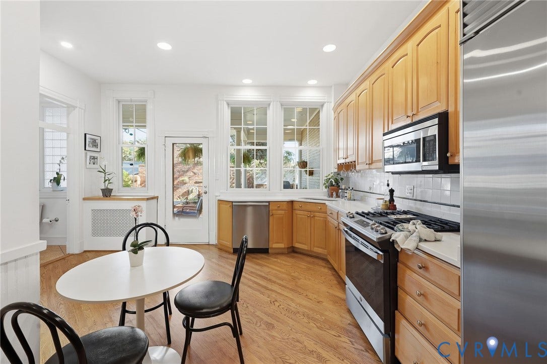 107 N Harvie Street, The Fan, Richmond, VA 23220 Kitchen featuring recessed lighting, wood cabinetry, stainless steel appliances, white tile backsplash, and wood-finish flooring