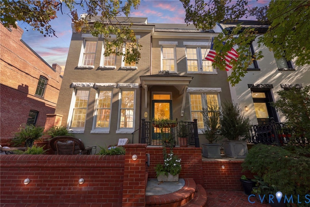 107 N Harvie Street, The Fan, Richmond, VA 23220 Multi-story masonry exterior featuring a raised brick terrace, covered entryway, and multi-pane windows