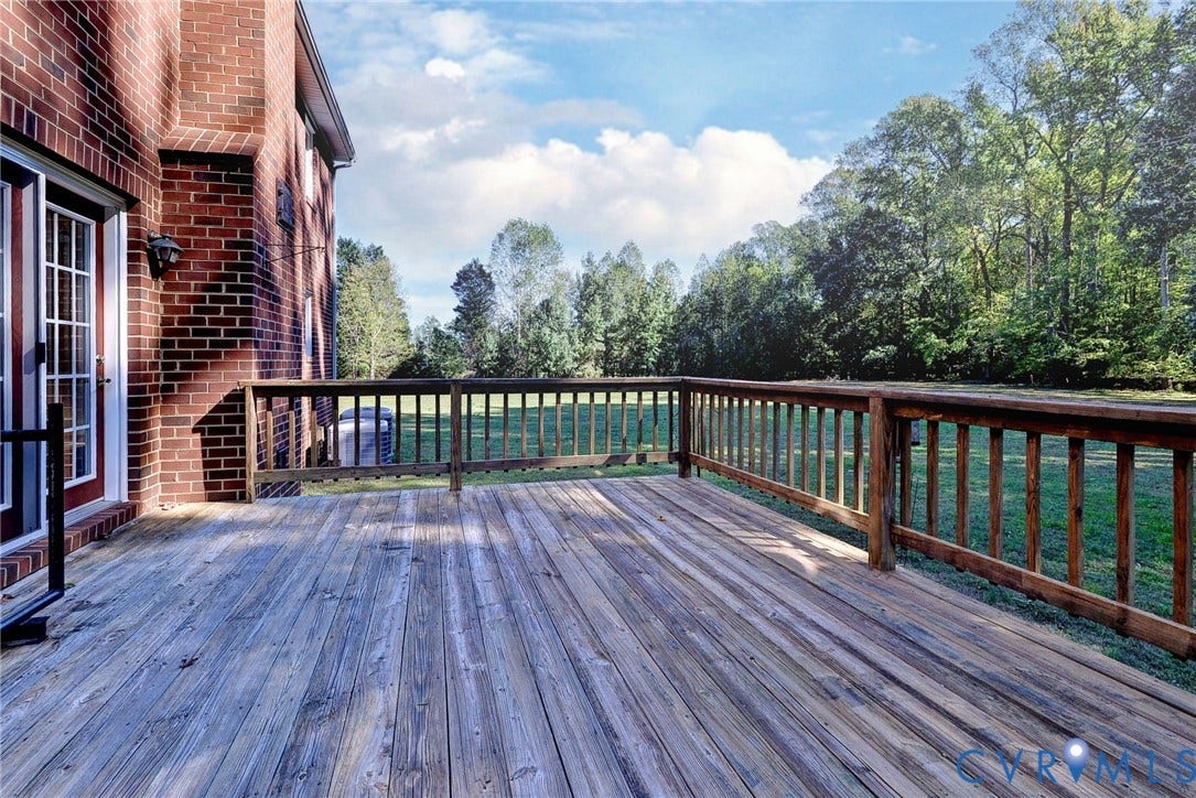 14151 Black Horse Lane, Lanexa, VA 23089 Exterior wood deck featuring a railing and brick home siding