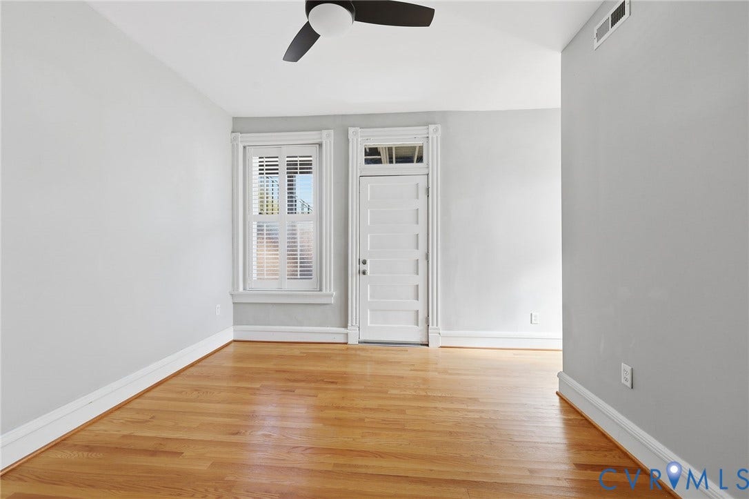 101 N Stafford Avenue, #U4, Stafford Terrace Condo, Richmond, VA 23220 Interior room featuring wood-finish flooring, a multi-pane door with a transom window, window shutters, and a ceiling fan