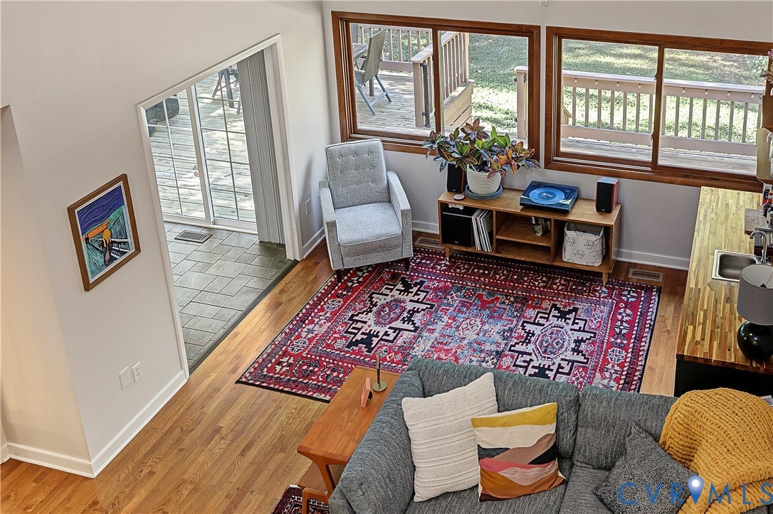 3800 Pheasant Hollow Drive, Henrico, VA 23231 Vaulted ceilings, wood-finish flooring, sliding glass patio doors, oversized horizontal windows, and a built-in butcher block countertop