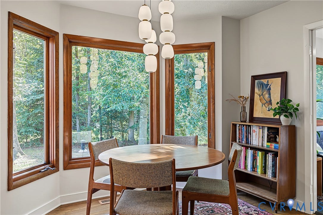 3800 Pheasant Hollow Drive, Henrico, VA 23231 Bay window featuring natural wood-trimmed casement windows, wood-finish flooring, and a multi-pendant modern light fixture