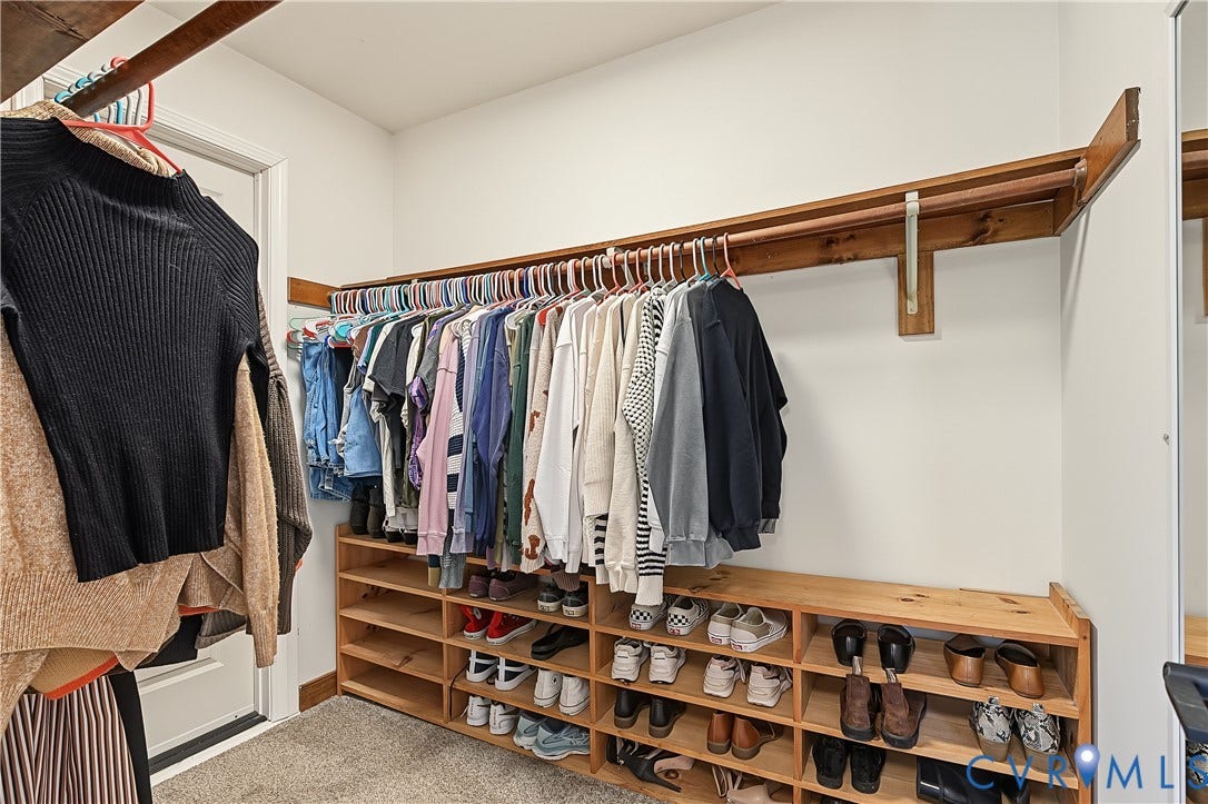 3800 Pheasant Hollow Drive, Henrico, VA 23231 Walk-in closet featuring multi-tiered natural wood shelving and integrated rod storage