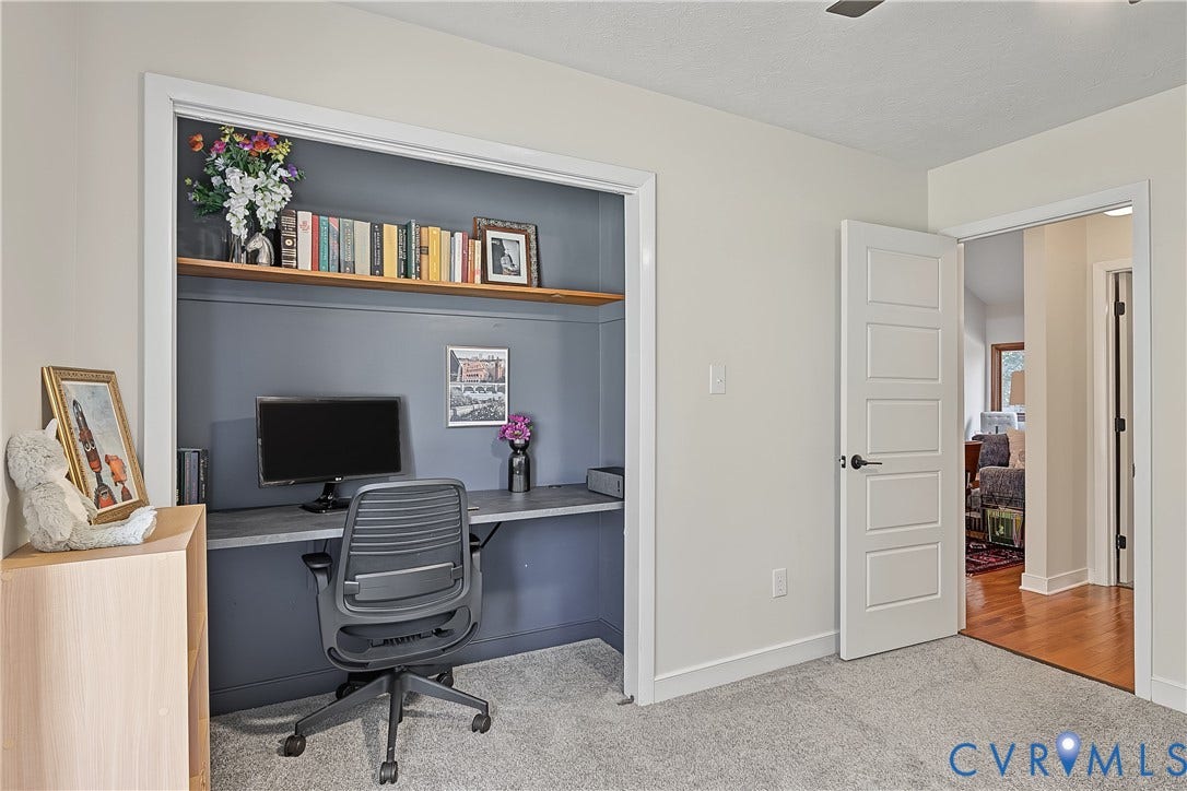 3800 Pheasant Hollow Drive, Henrico, VA 23231 Built-in alcove featuring a desk surface, shelving, and neutral-tone wall finish, complemented by a five-panel interior door
