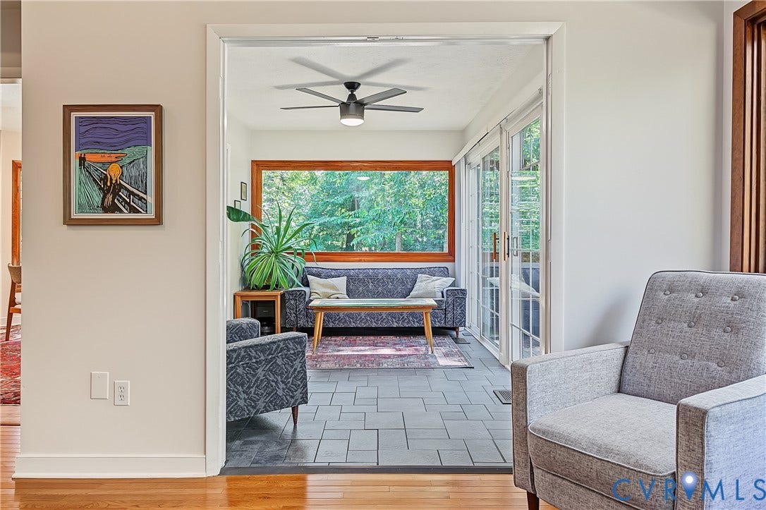 3800 Pheasant Hollow Drive, Henrico, VA 23231 Sunroom featuring slate tile flooring, a large picture window, sliding glass doors, and a ceiling fan