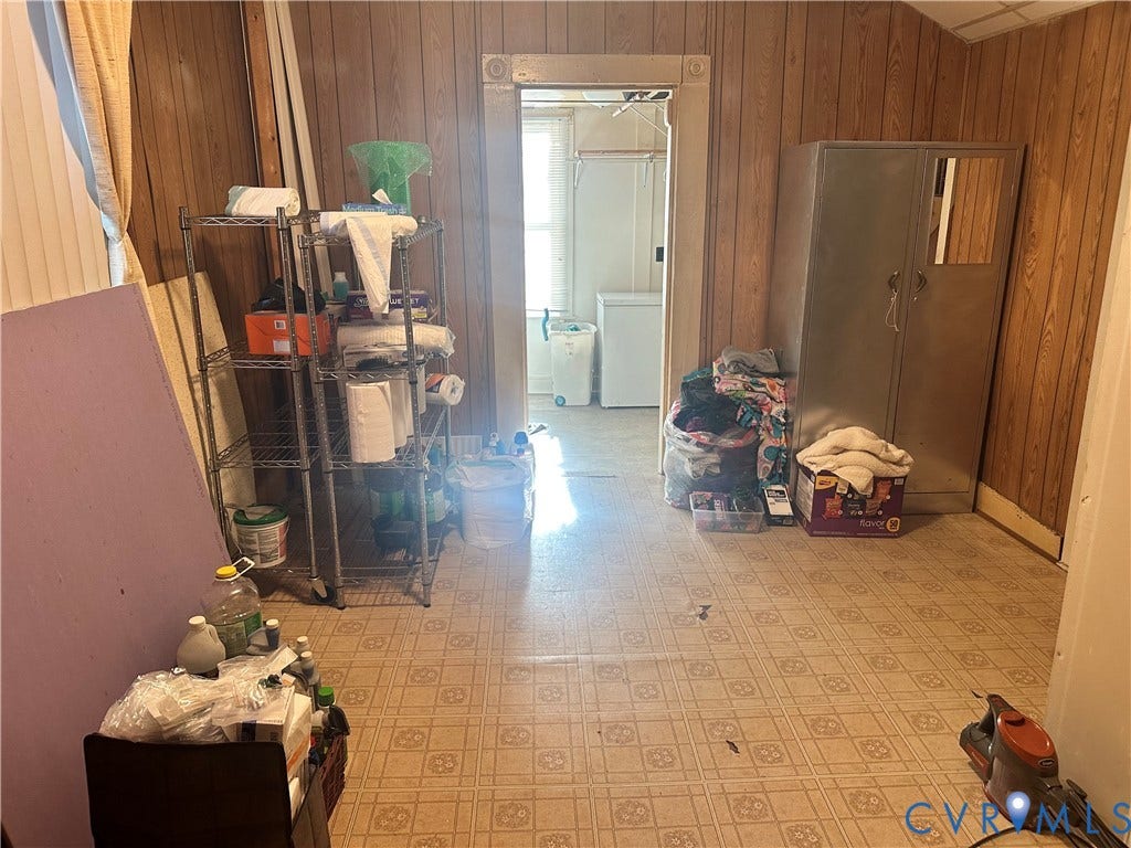 5 N Daisy Avenue, Henrico, VA 23075 Wood-paneled wall surfaces and patterned resilient tile flooring