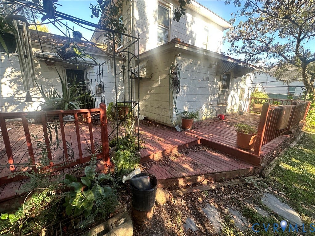 5 N Daisy Avenue, Henrico, VA 23075 Multi-level wood deck featuring vertical wood railings and metal awning covers