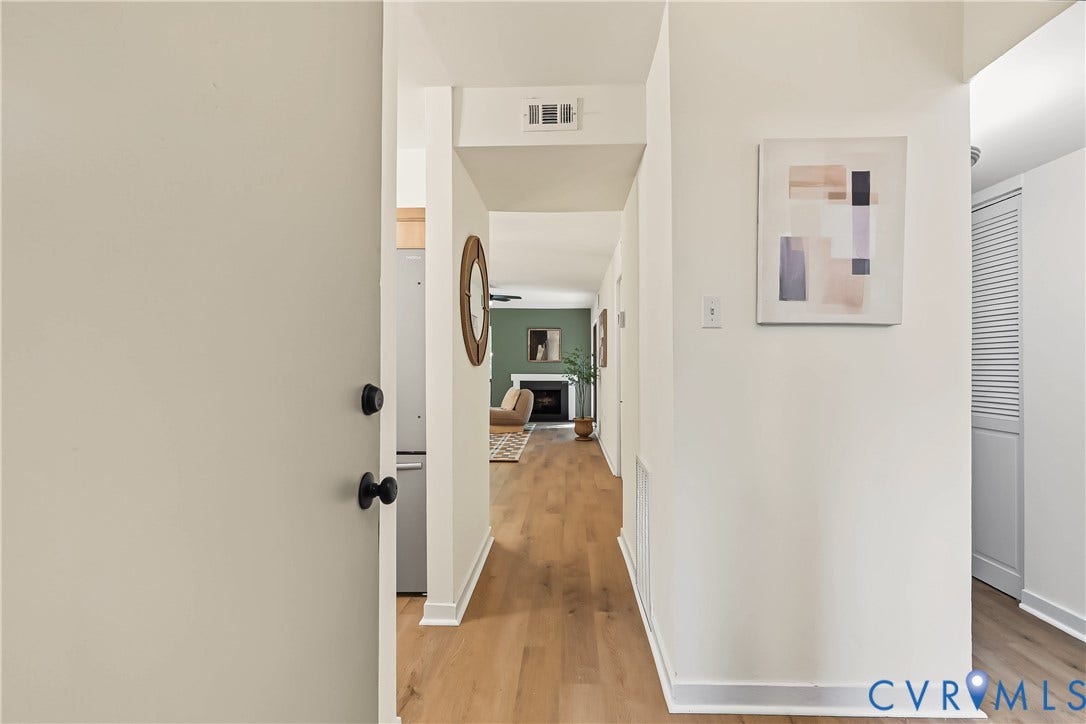 10272 Iron Mill Road, North Chesterfield, VA 23235 Entryway featuring wood-finish flooring, white walls, and a louvered-panel closet door