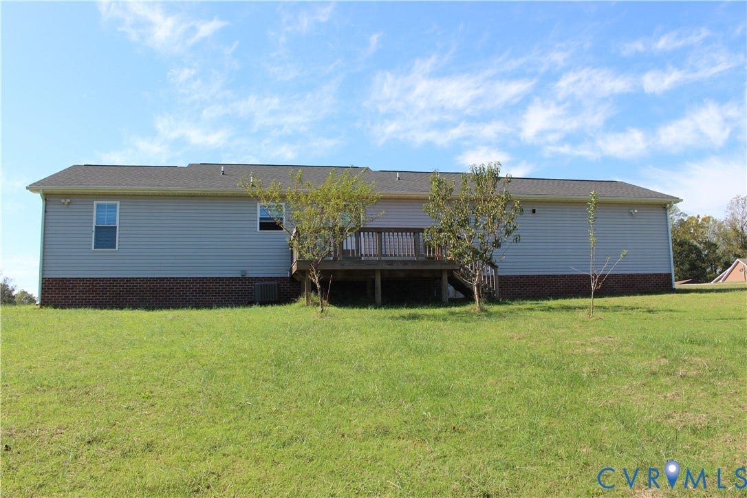 118 Clements Drive, Essex, VA 22560 Exterior featuring horizontal siding, a masonry foundation, and a raised wooden deck