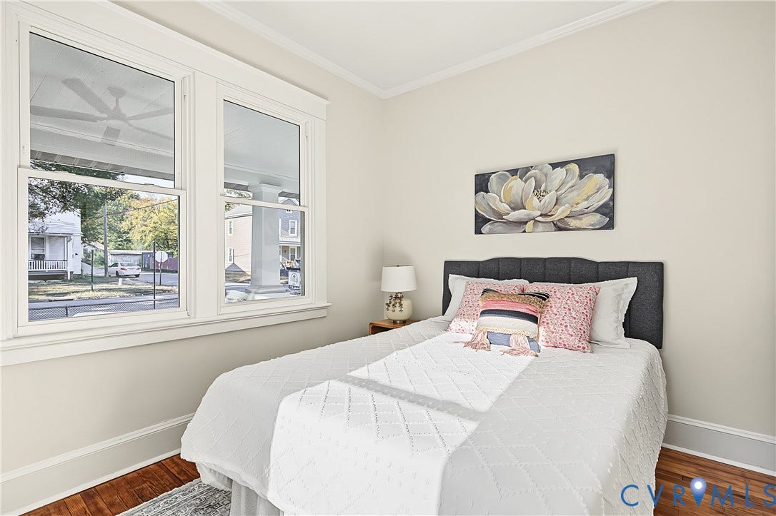 3500 Stockton Street, Weisigers Plan, Richmond, VA 23224 Double-hung windows with craftsman-style trim, wood-finish flooring, and crown molding