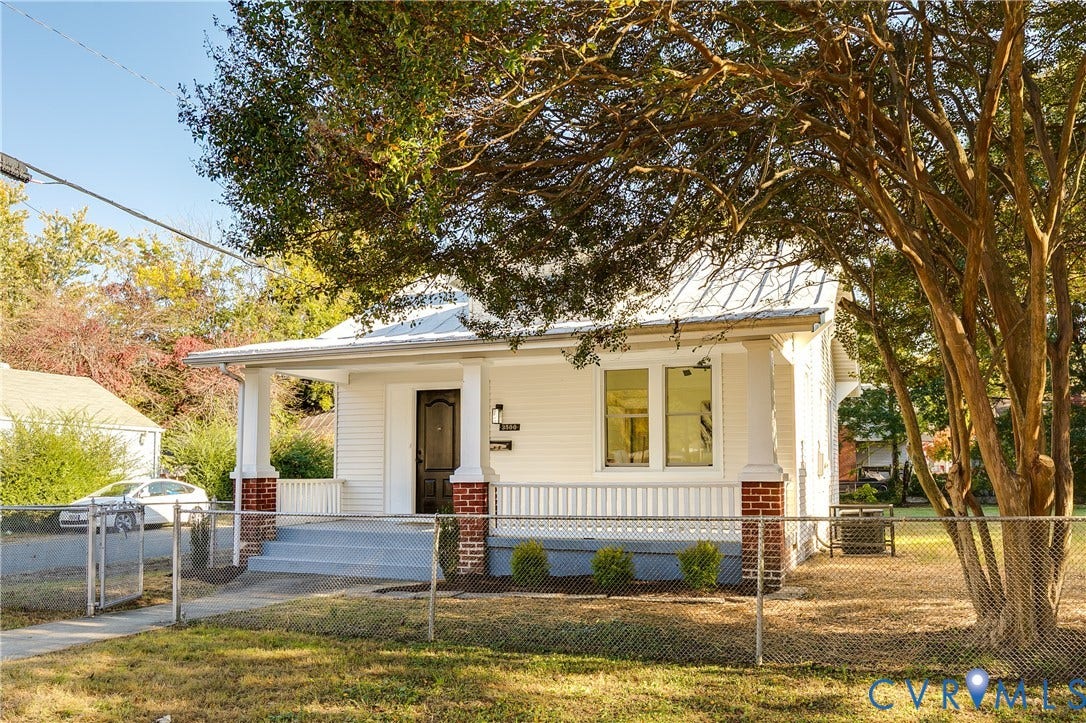 3500 Stockton Street, Weisigers Plan, Richmond, VA 23224 Exterior featuring white siding, a covered front porch with brick column bases, square support columns, and a metal roof
