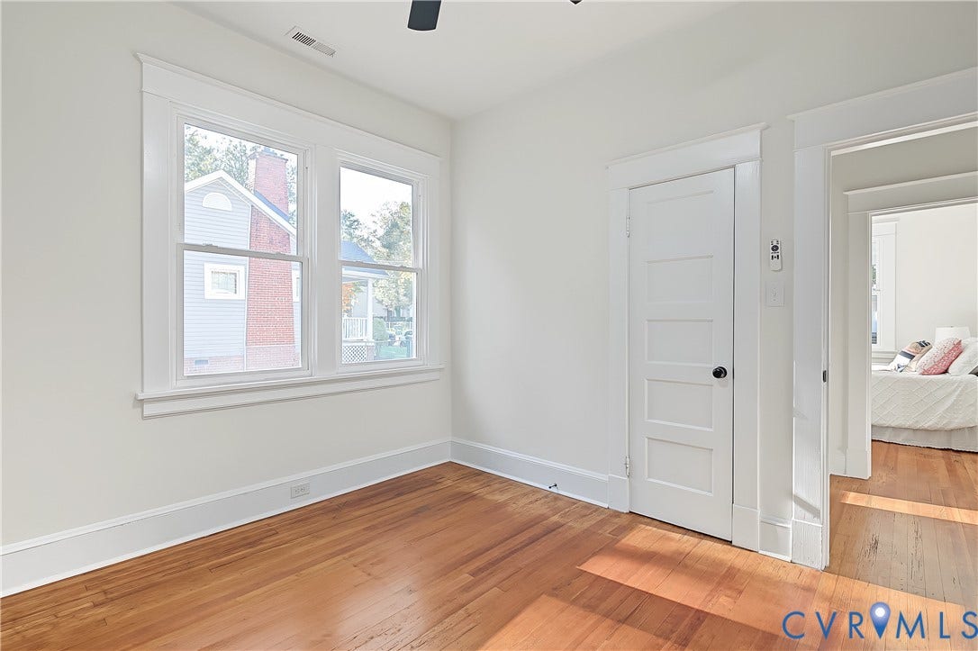 3500 Stockton Street, Weisigers Plan, Richmond, VA 23224 Room featuring wood-finish flooring, multi-pane windows, and five-panel interior door with white casing and trim