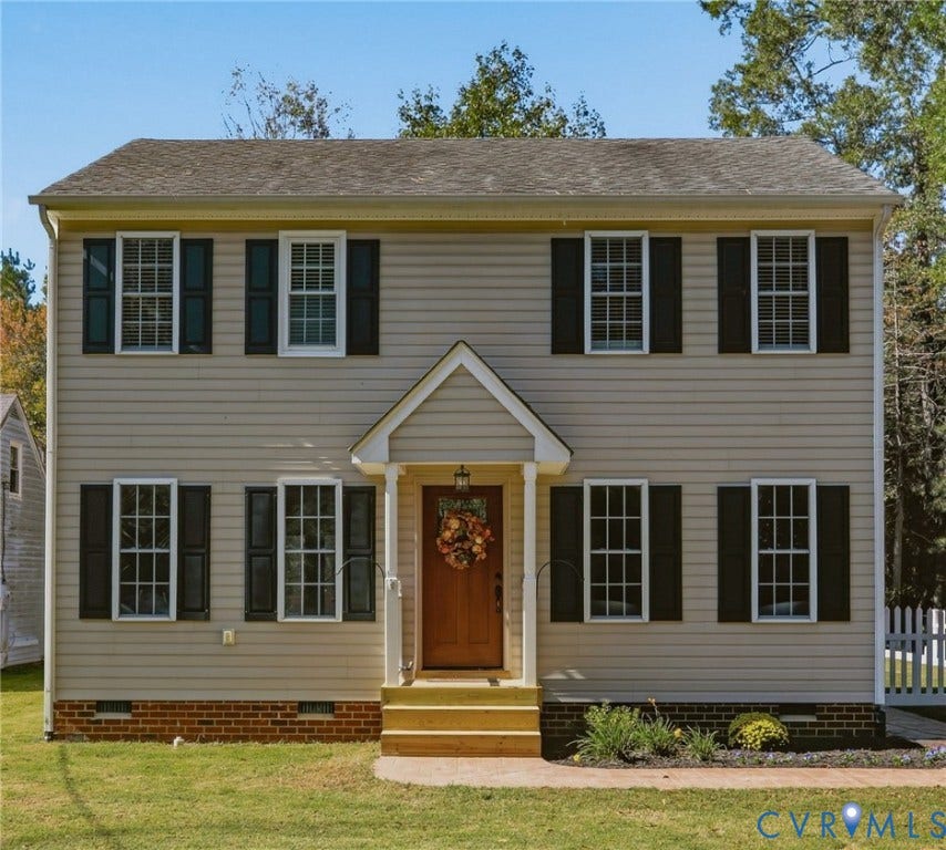 308 N Snead Street, #A, Ashland, VA 23005 Two-story residence featuring horizontal lap siding, a gable-roofed front entry porch, multi-pane windows with shutters, and a brick-veneer foundation base