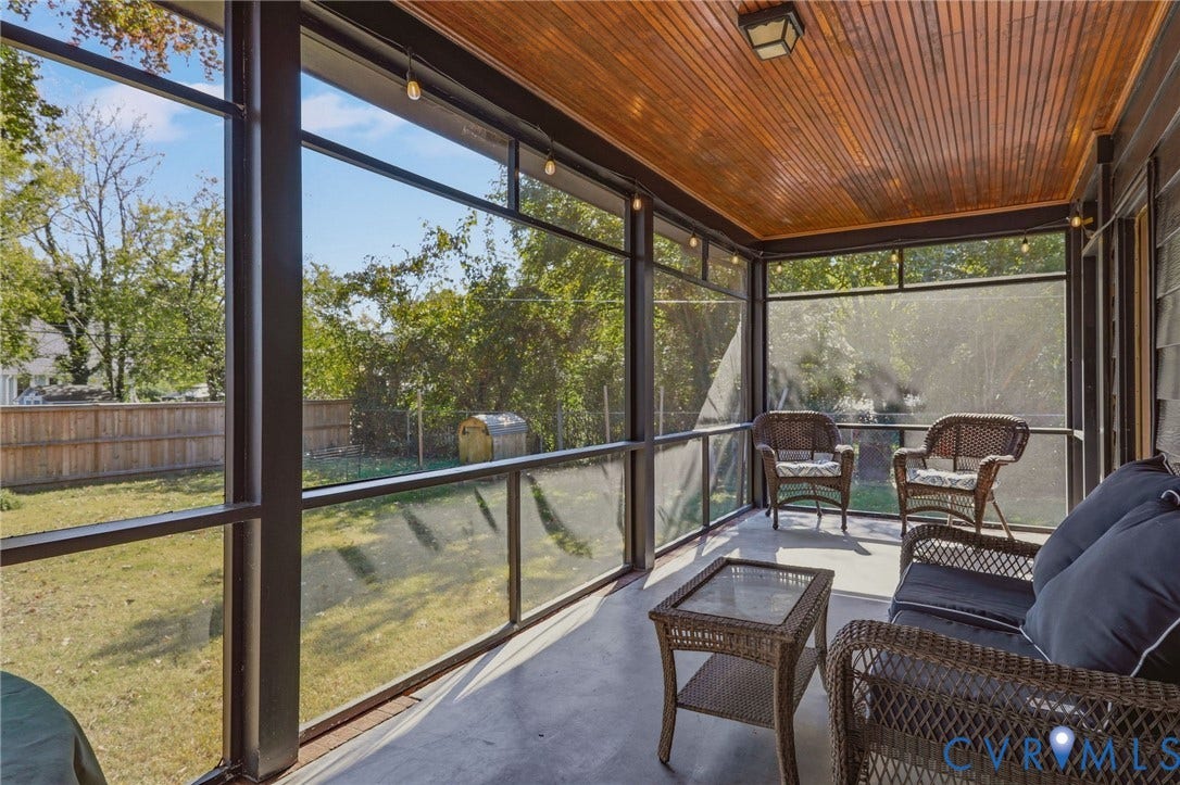 9 E 31st Street, Richmond, VA 23224 Screened-in porch featuring a natural wood-plank ceiling, structural metal framing, and a concrete floor