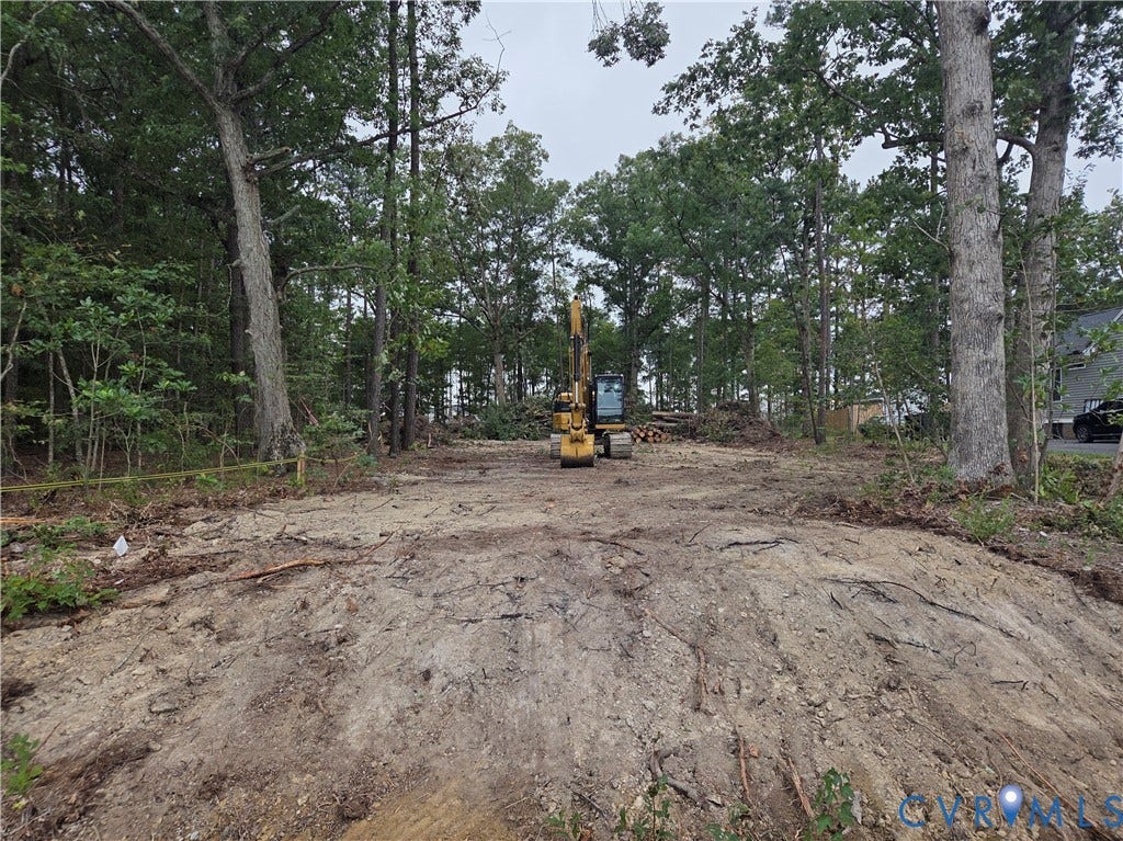 11571 Edinburgh Road, Glen Allen, VA 23060 Clearing featuring mature trees, wooded perimeter, and leveled earth