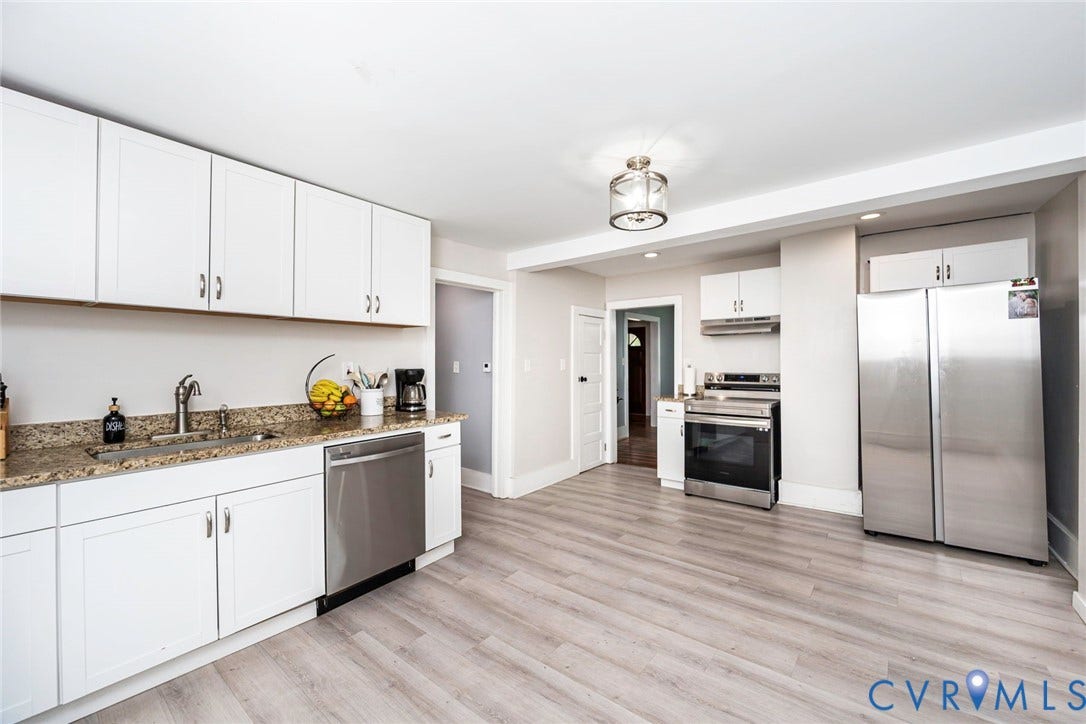 1818 Arlington Road, Hopewell, VA 23860 Kitchen featuring white cabinetry, stone-finish countertops, stainless steel appliances, and wood-finish flooring