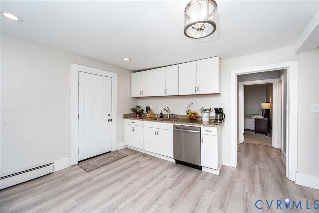 1818 Arlington Road, Hopewell, VA 23860 Kitchenette featuring white cabinetry, stone-finish countertops, stainless steel dishwasher, wood-finish flooring, and a glass-accented ceiling light fixture