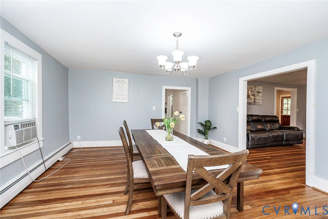 1818 Arlington Road, Hopewell, VA 23860 Hardwood flooring, five-light candelabra chandelier, and traditional window trim