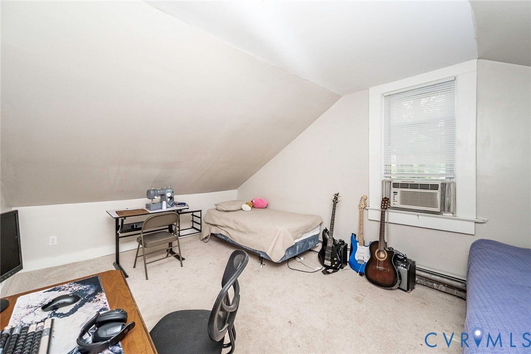 1818 Arlington Road, Hopewell, VA 23860 Sloped ceiling, neutral wall tones, wall-to-wall carpeting, and a window with a fitted air conditioning unit
