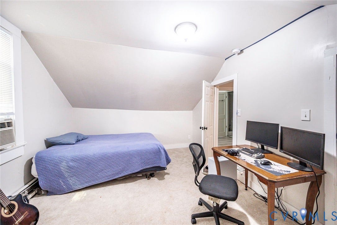 1818 Arlington Road, Hopewell, VA 23860 Sloped ceiling architecture with neutral wall tones, wall-to-wall carpeting, and a flush-mount ceiling light fixture