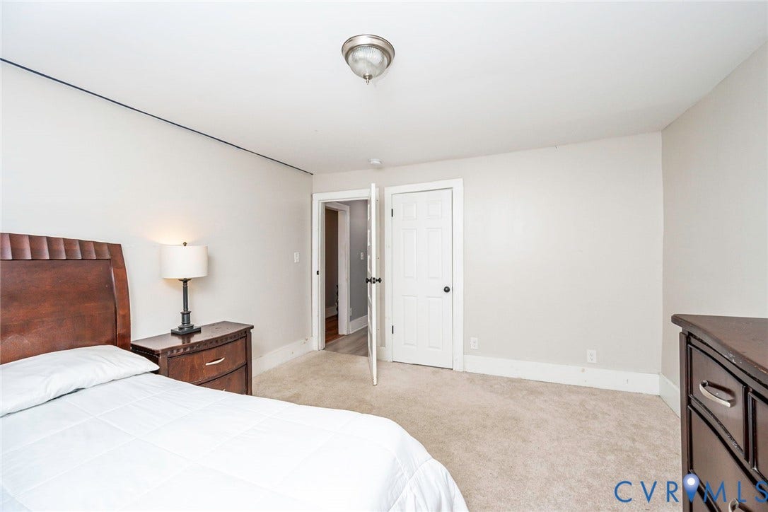 1818 Arlington Road, Hopewell, VA 23860 Neutral wall tones, carpeted flooring, and a six-panel interior door
