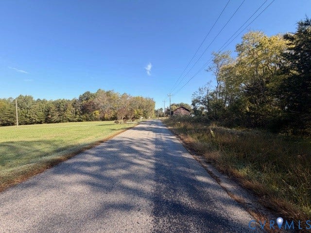 0 S genito Road, Genito, Burkeville, VA 23922 Asphalt road frontage bordered by open pasture, mature trees, and dense foliage