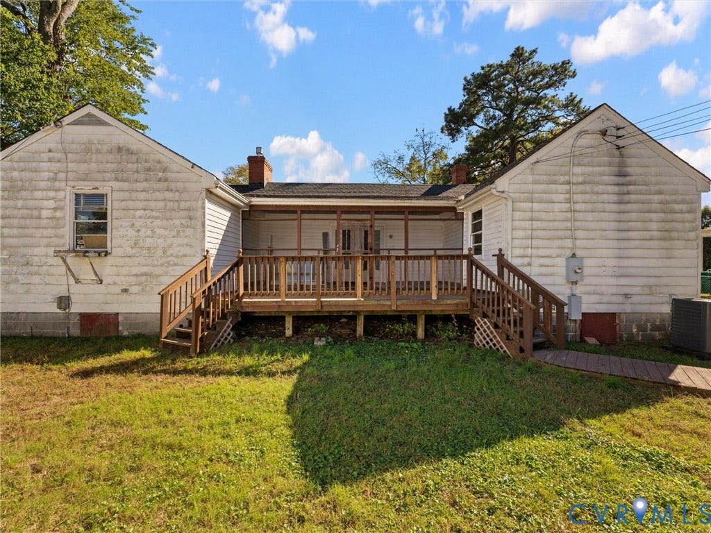 2900 Overton Road, Henrico, VA 23228 Exterior view featuring a rear screened-in porch with wood railings and dual access staircases, complemented by a roof with two chimneys and white siding