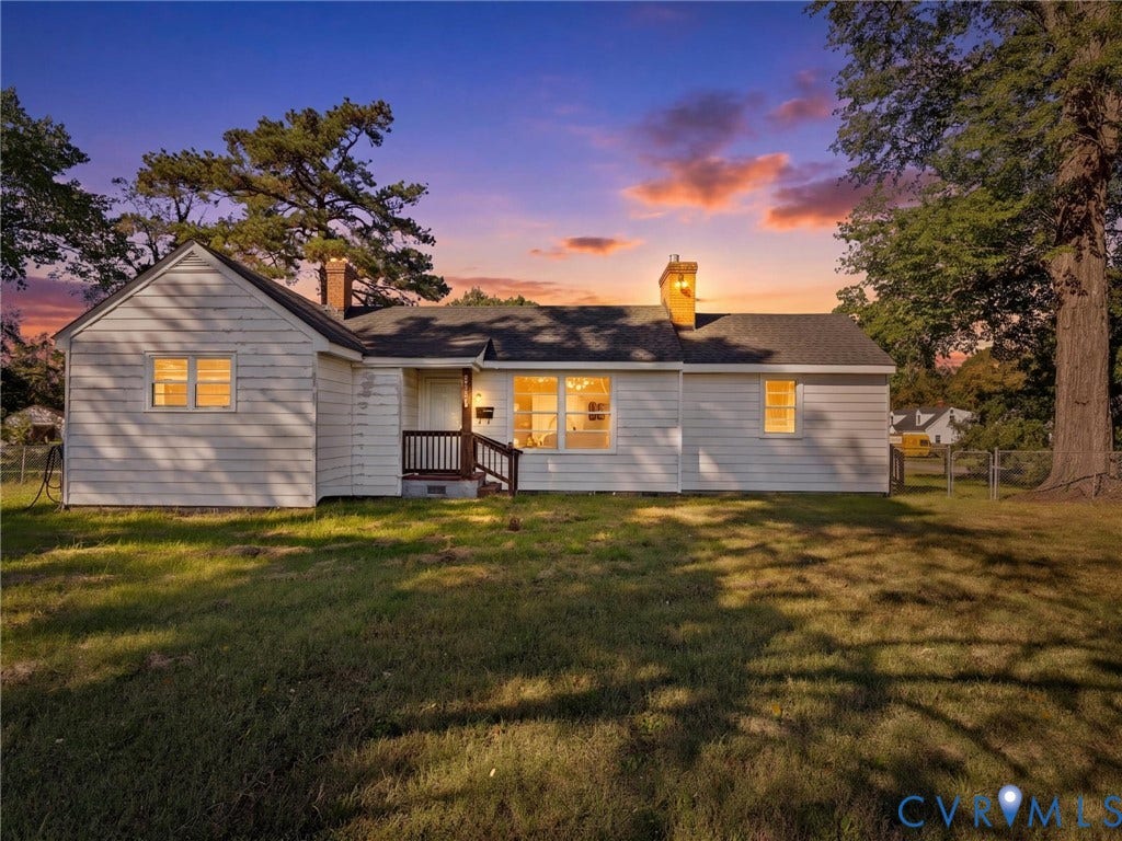 2900 Overton Road, Henrico, VA 23228 Single-story residence featuring horizontal siding, a gabled roofline, dual masonry chimneys, and a covered front entry