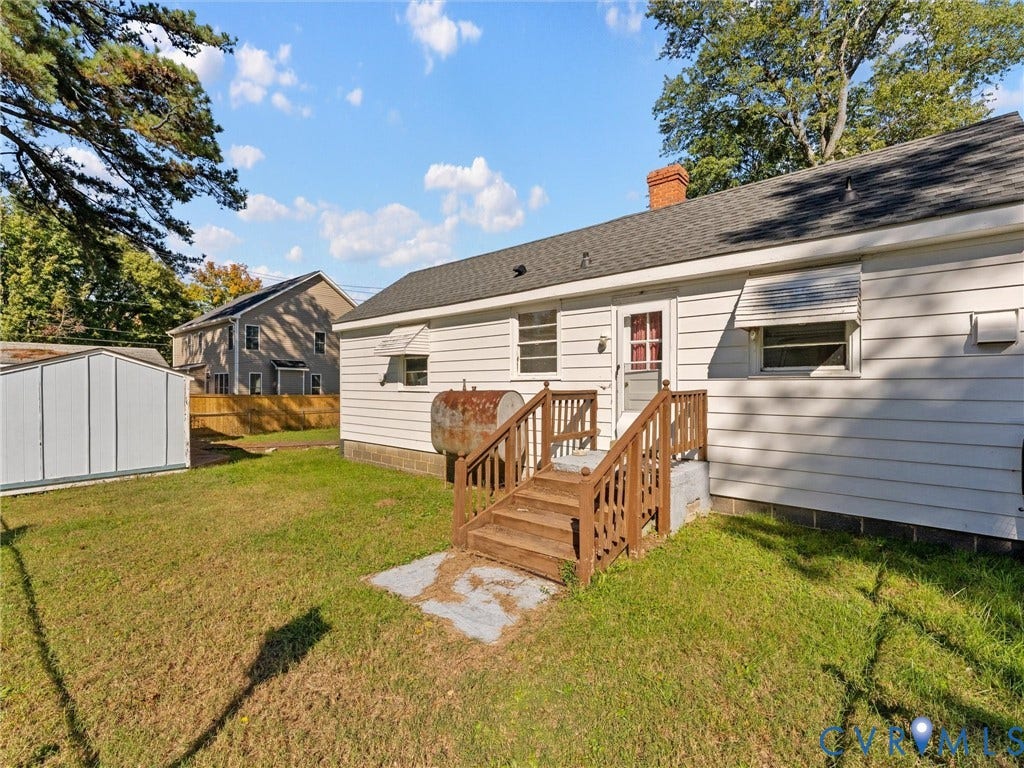 2900 Overton Road, Henrico, VA 23228 Exterior of the residence featuring horizontal siding, a pitched shingle roof, a brick chimney, metal window awnings, and a wooden staircase