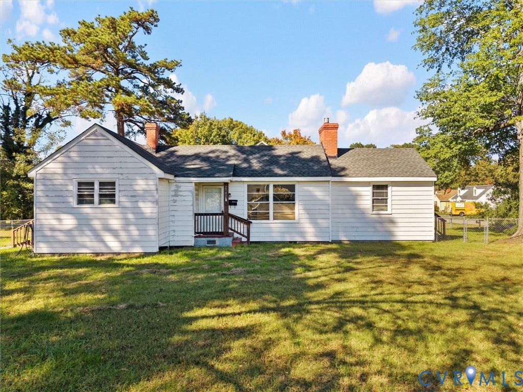 2900 Overton Road, Henrico, VA 23228 Single-story residence featuring horizontal siding, dual brick chimneys, a shingled roof, and a covered front entry