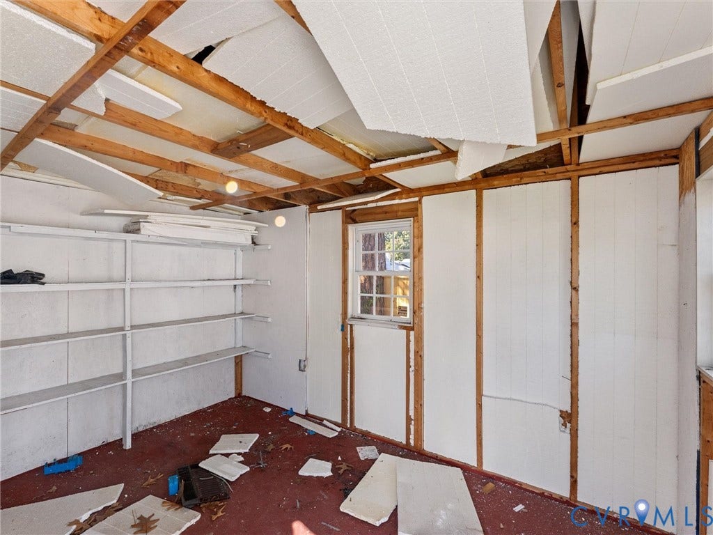 2900 Overton Road, Henrico, VA 23228 Interior space featuring exposed wood framing, built-in wooden shelving, and a single-hung window