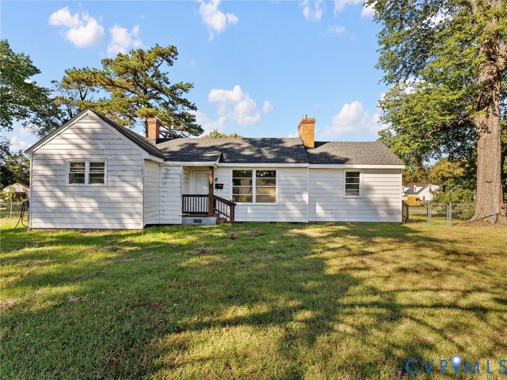 2900 Overton Road, Henrico, VA 23228 Single-story exterior featuring light-toned horizontal siding, two brick chimneys, a shingle roof, and a covered entryway with wooden railings