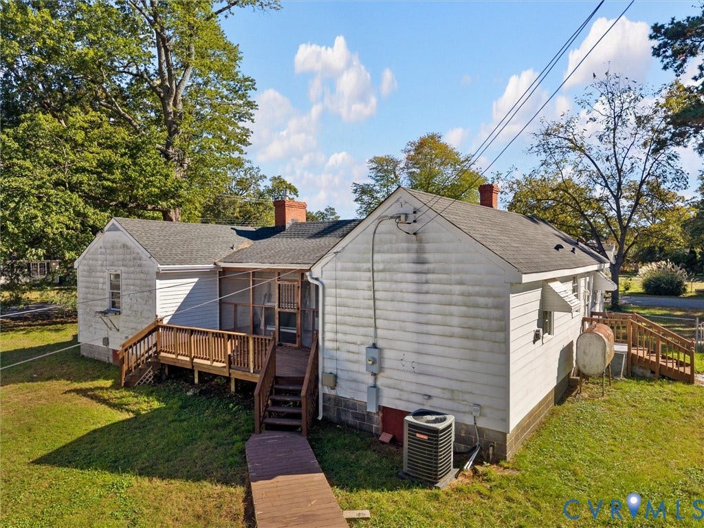 2900 Overton Road, Henrico, VA 23228 Exterior featuring white siding, a shingled roof with dual brick chimneys, a screened-in porch, wood decking, and a grass-covered lot