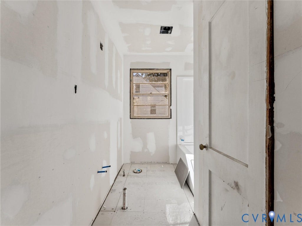 2900 Overton Road, Henrico, VA 23228 Interior space featuring unfinished drywall, subflooring, a single-hung window, and a recessed ceiling light fixture