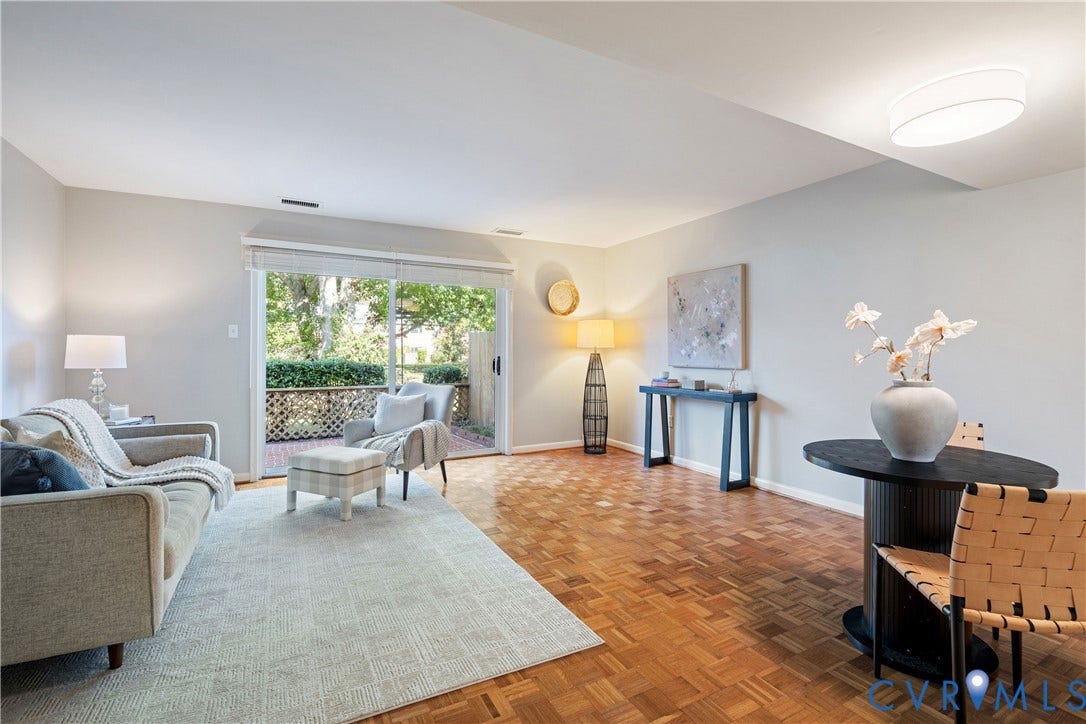 9131 Derbyshire Road, #B, Deerwood Condominiums, Henrico, VA 23229 Parquet wood-finish flooring, sliding glass door, flush-mount ceiling lighting, and exterior lattice fencing