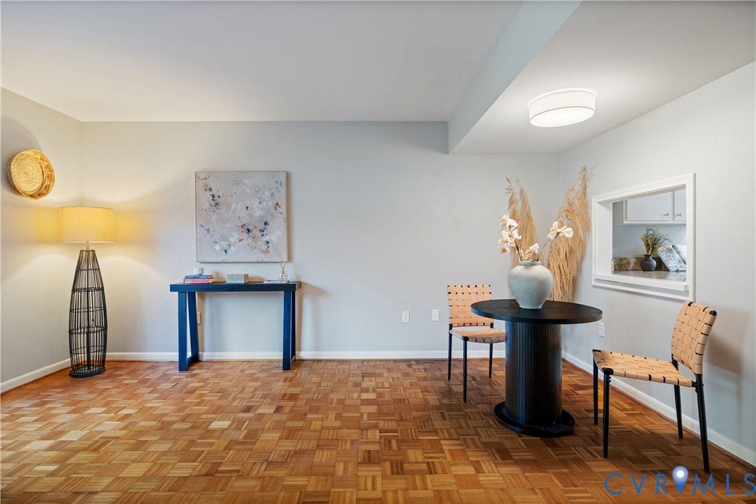 9131 Derbyshire Road, #B, Deerwood Condominiums, Henrico, VA 23229 Parquet wood-finish flooring, ceiling-mounted dome light fixture, and interior pass-through opening